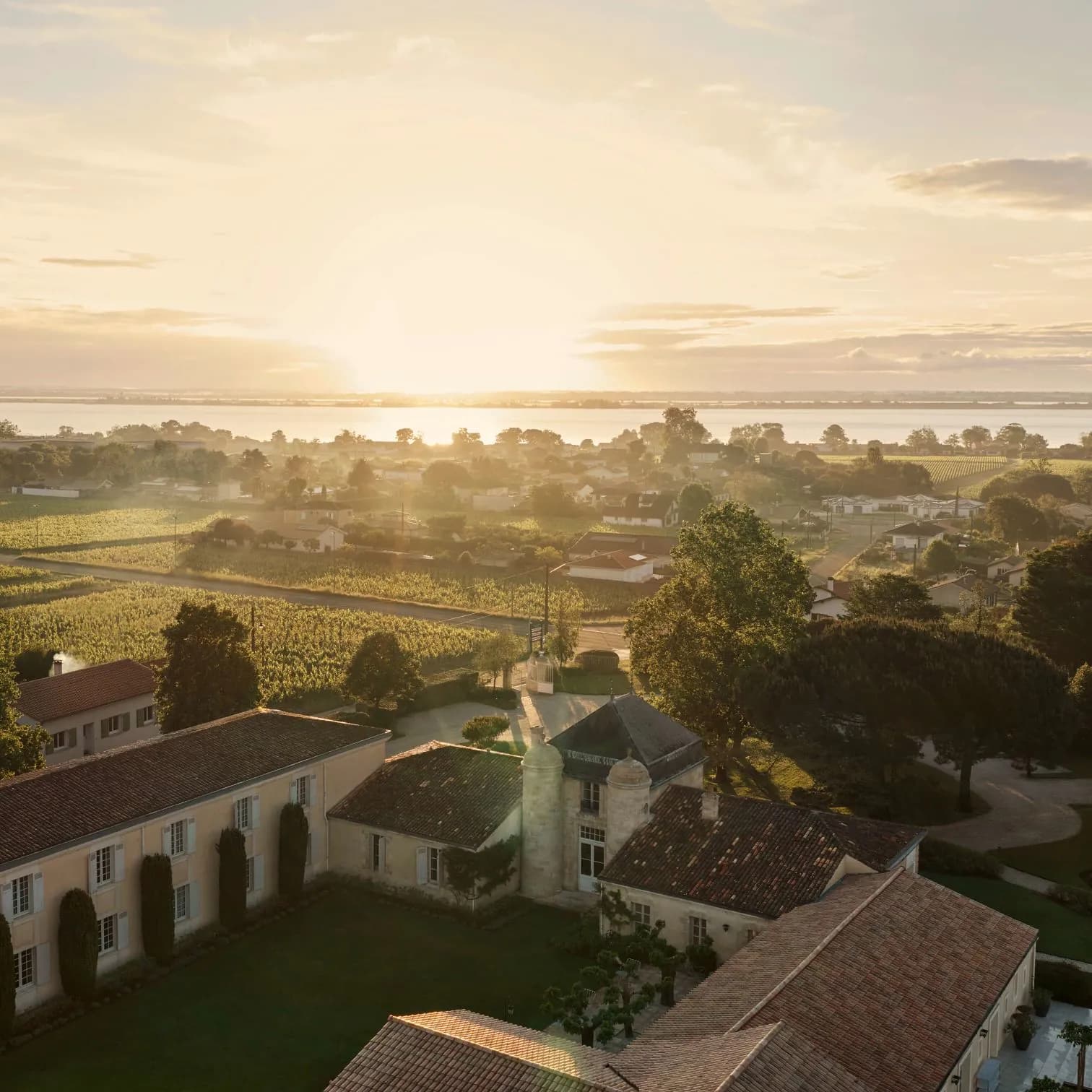 Aerial view of COMO Cordeillan-Bages at sunset, with its château and vineyards near Pauillac