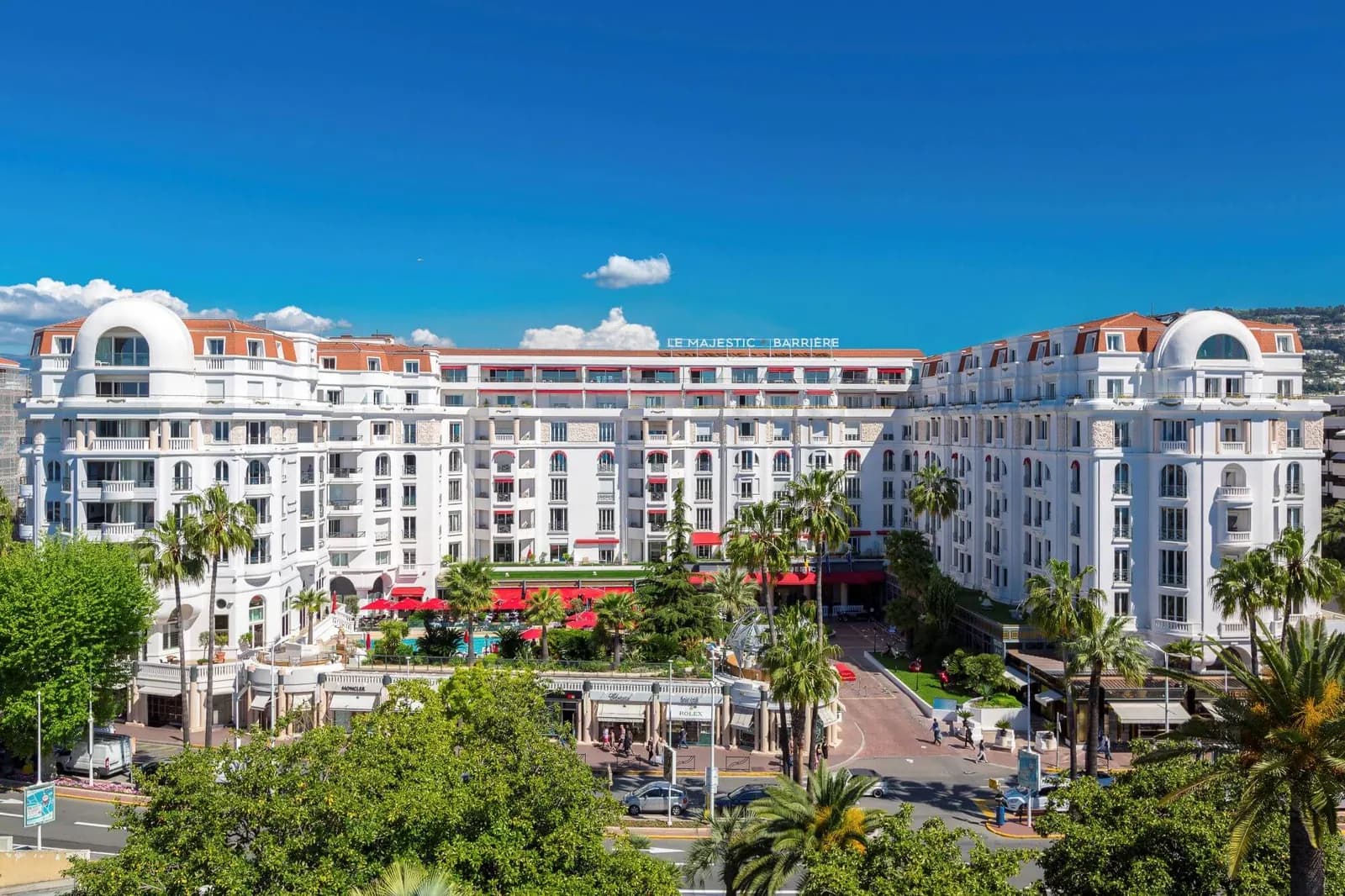 Facade of the white Belle Époque Hôtel Majestic Barrière on the Croisette in Cannes