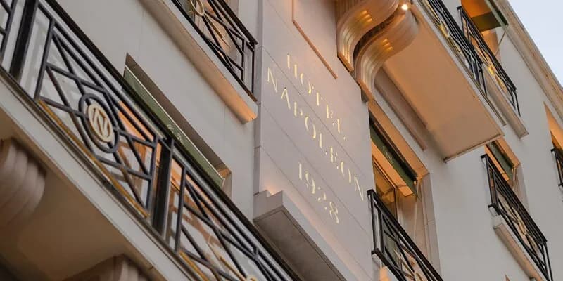 Facade of Hôtel Napoléon with its name carved above the entrance on avenue de Friedland, Paris