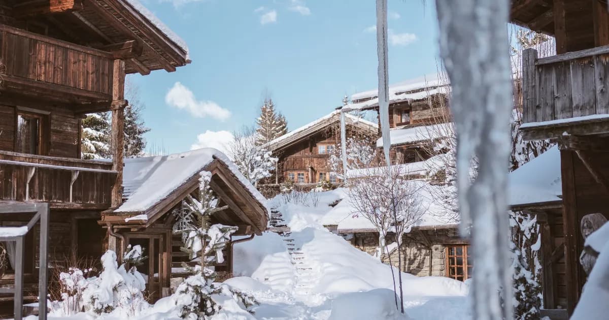 Winter view of the chalet-style buildings of Les Fermes de Marie hotel in Megève, Haute-Savoie