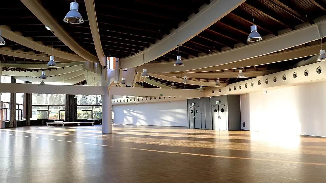 Ground-floor hall with bay windows facing a garden