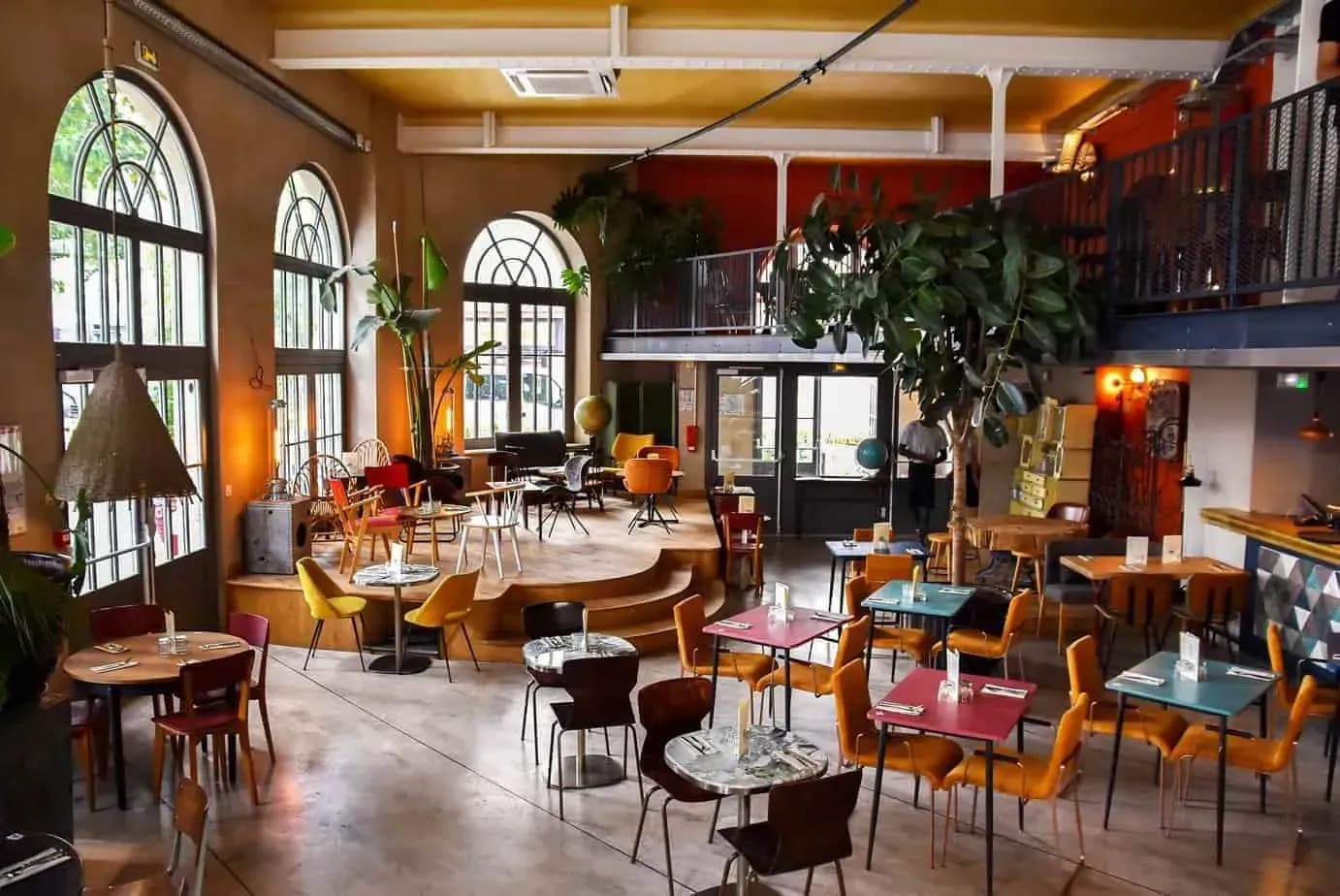 Restaurant interior with stained glass and high ceilings in a former station