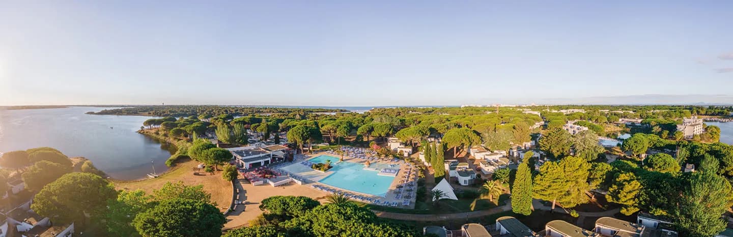 Aerial view of Domaine des Pinèdes Languedociennes on the Mediterranean, with the lagoon, pools and pine grove