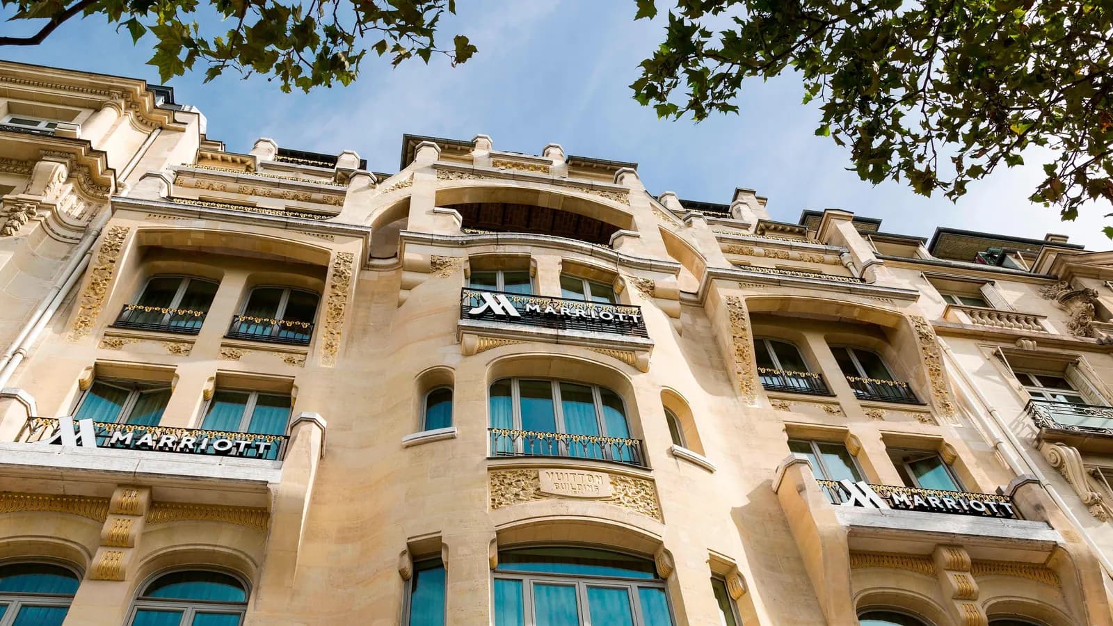 Facade of the Paris Marriott Champs-Elysees Hotel with its Marriott signage and wrought-iron balconies on the avenue
