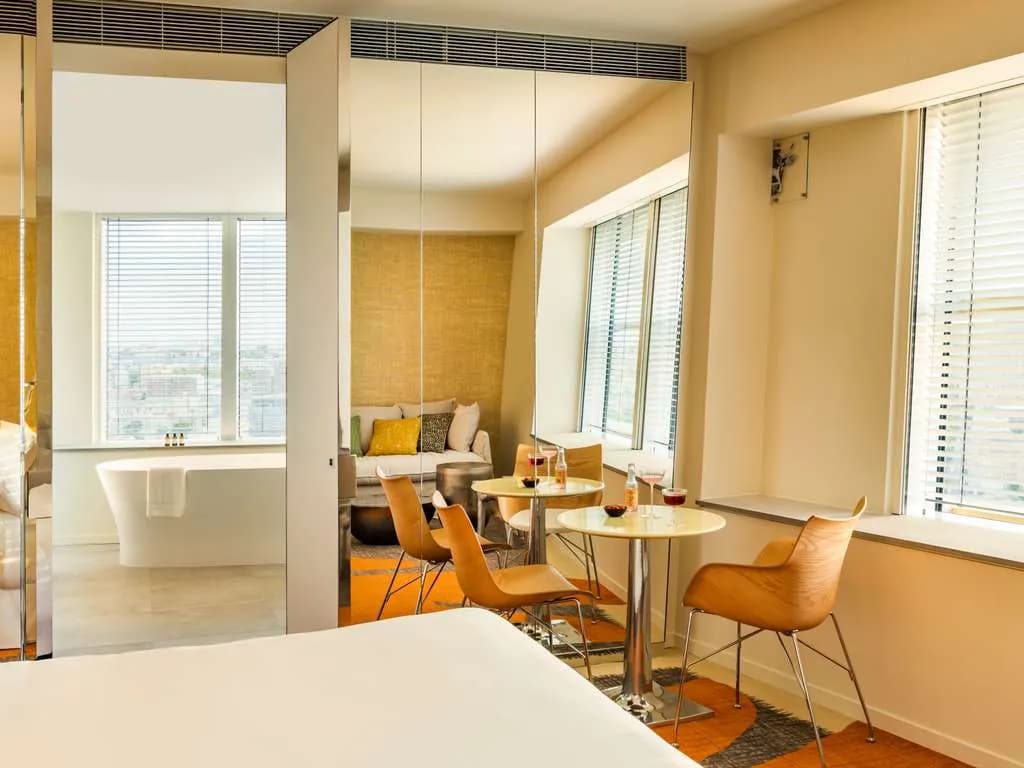 Guest room at TOO Hotel & Spa Paris MGallery in the 13th arrondissement, with a freestanding bath by the window