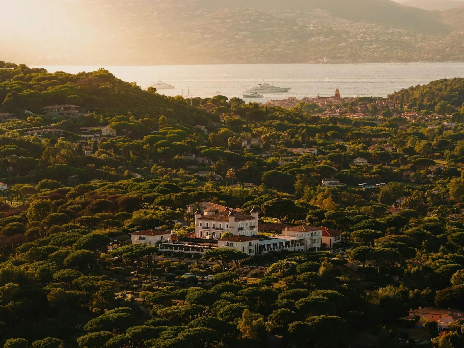 Aerial view of Airelles Château de la Messardière in the pine forest near Saint-Tropez