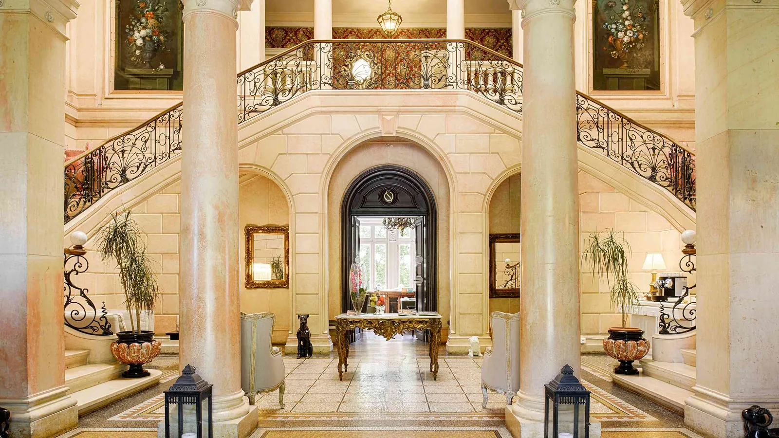 Grand staircase and columned entrance hall at Château des Quatre Vents, Isère, east of Lyon