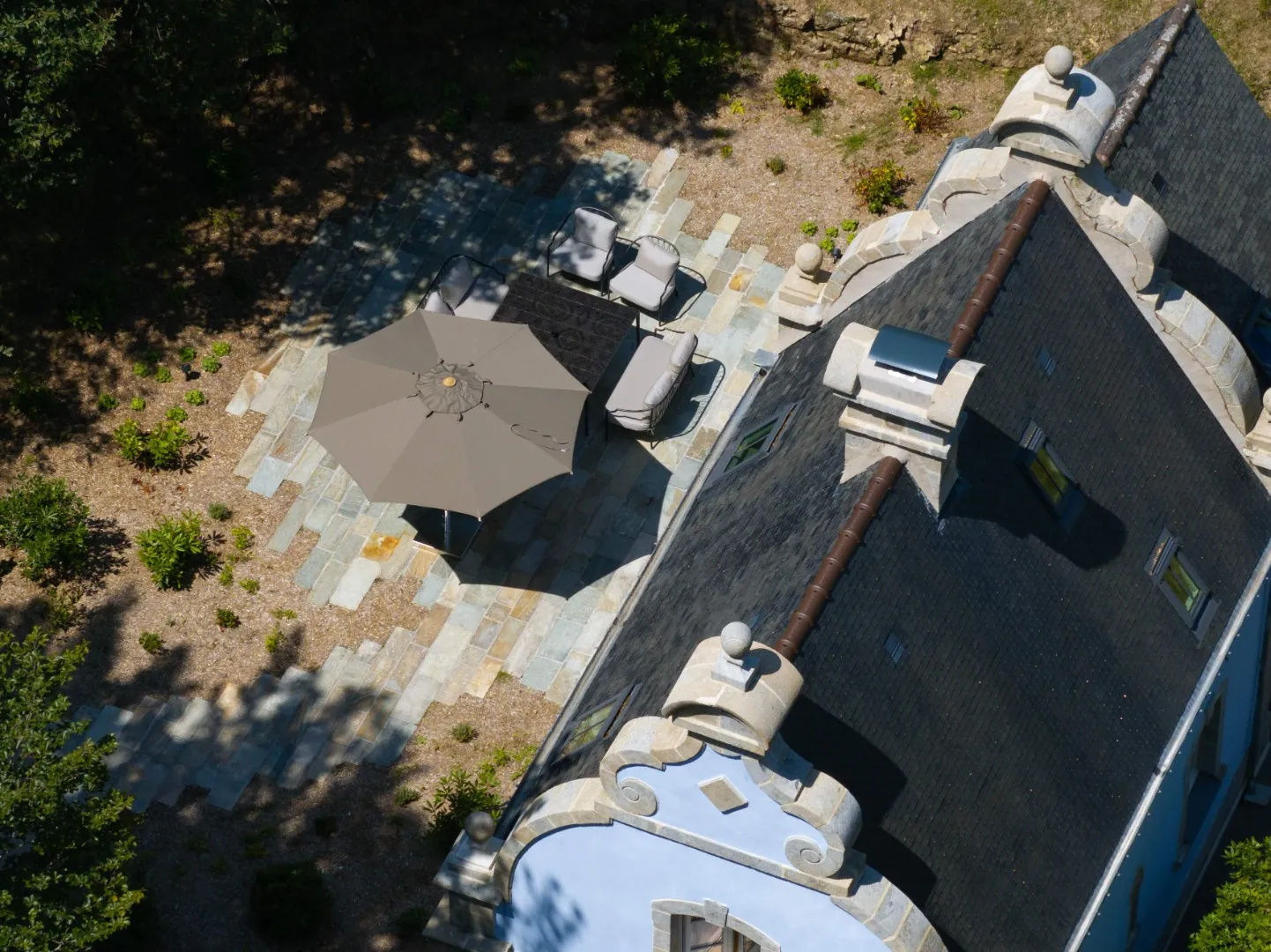 Aerial view of the rooftop and garden terrace of the Domaine de Locguénolé château, Kervignac