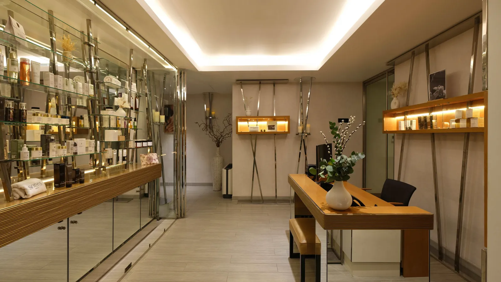 Lobby with display shelves and warm lighting at Five Seas Hotel Cannes, in the Cannes old town