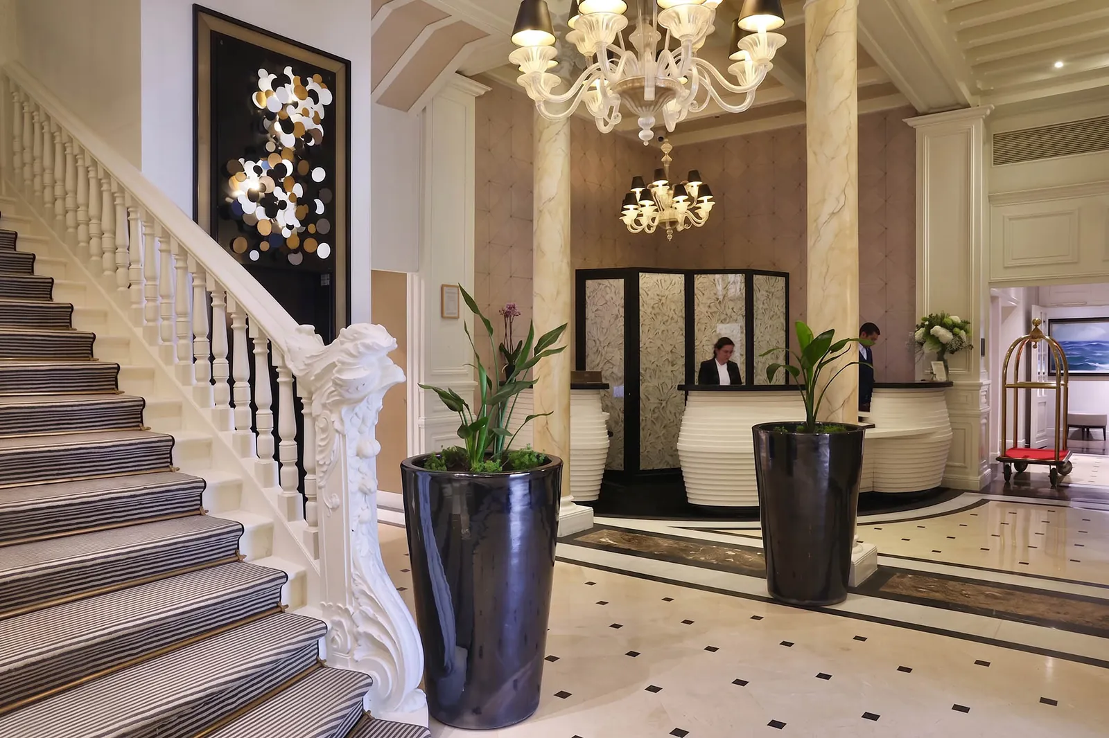 Grand marble staircase and reception desk in the lobby of the Grand Hôtel Loreamar, Saint-Jean-de-Luz