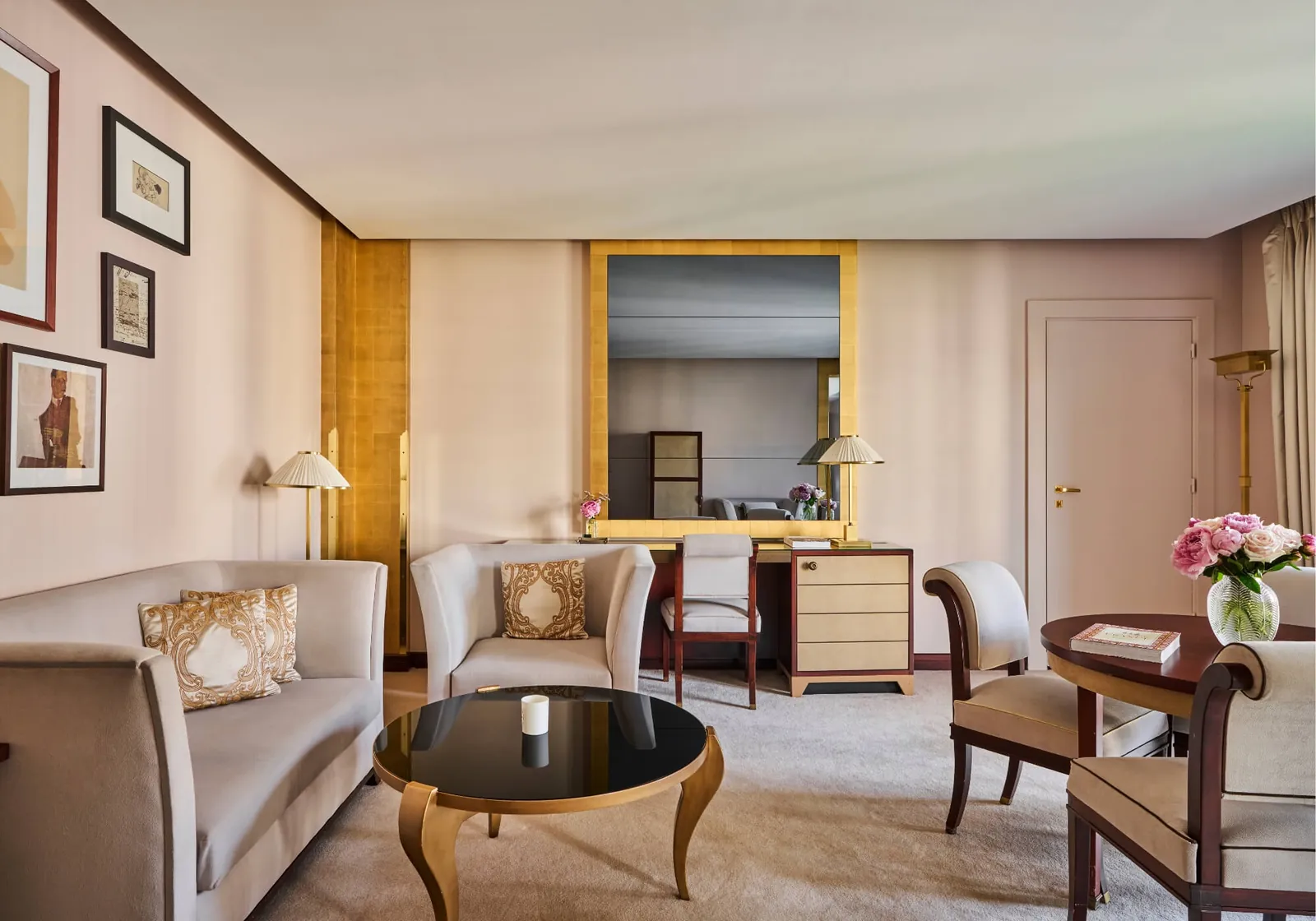 Junior suite living room with gilt mirror and armchairs at Fouquet's Paris hotel, Paris 8e