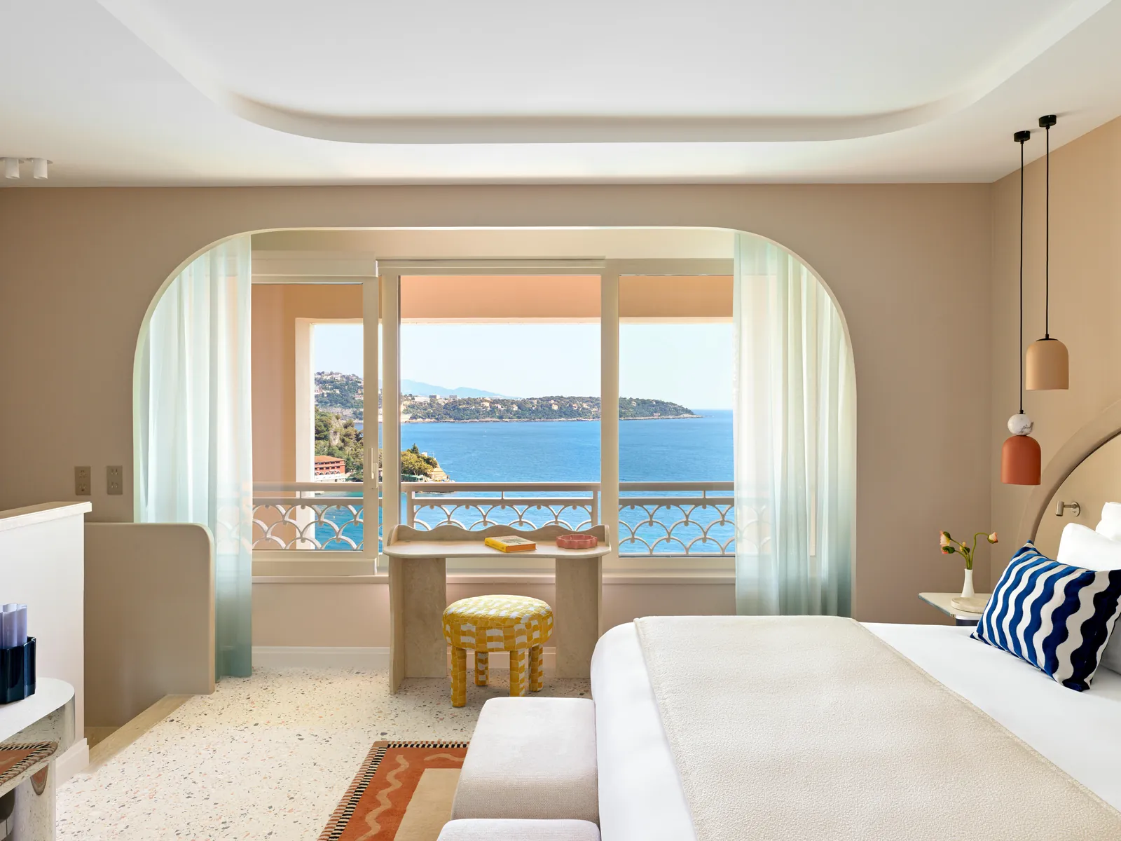 Bedroom with a large window onto the Mediterranean at Monte-Carlo Bay Hotel & Resort, Monaco