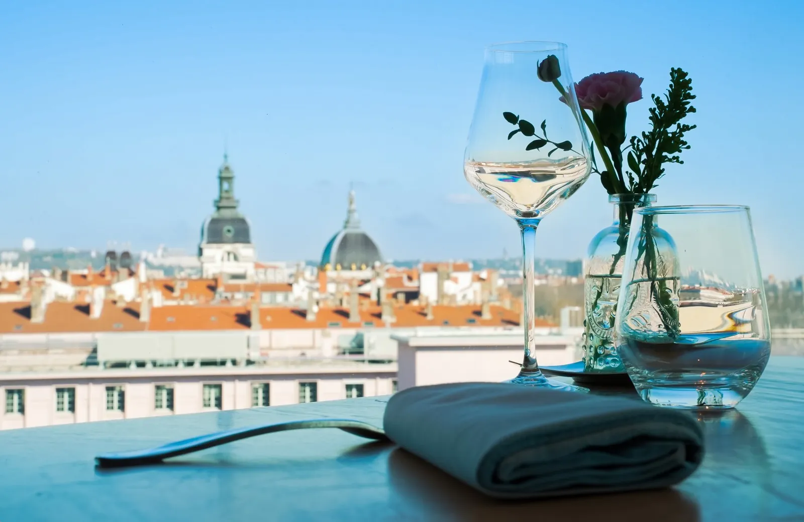 Rooftop drink with a view over the historic roofs of Lyon at the Sofitel Lyon Bellecour hotel