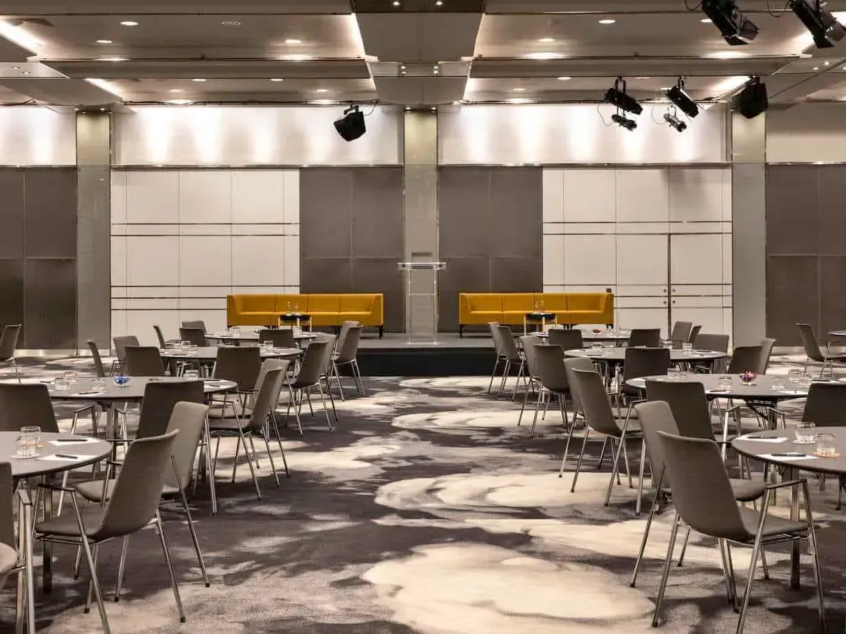 Grey conference hall with yellow seating in Bercy, Paris 12e