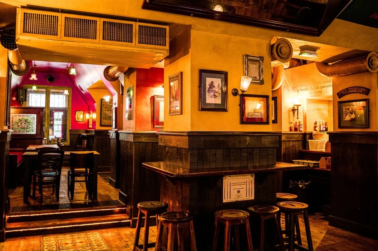 Corner bar with stools and framed prints