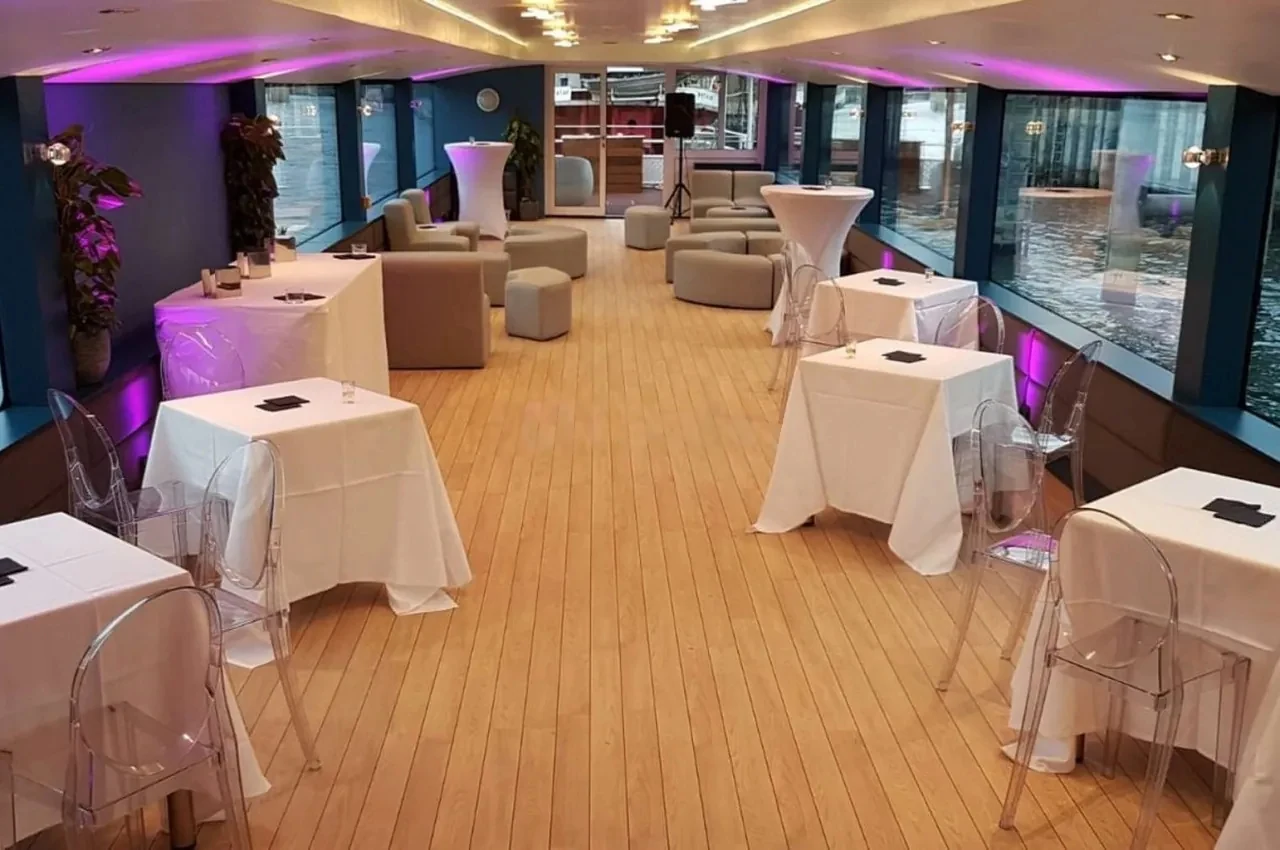 Upper deck with cocktail tables and a wooden floor