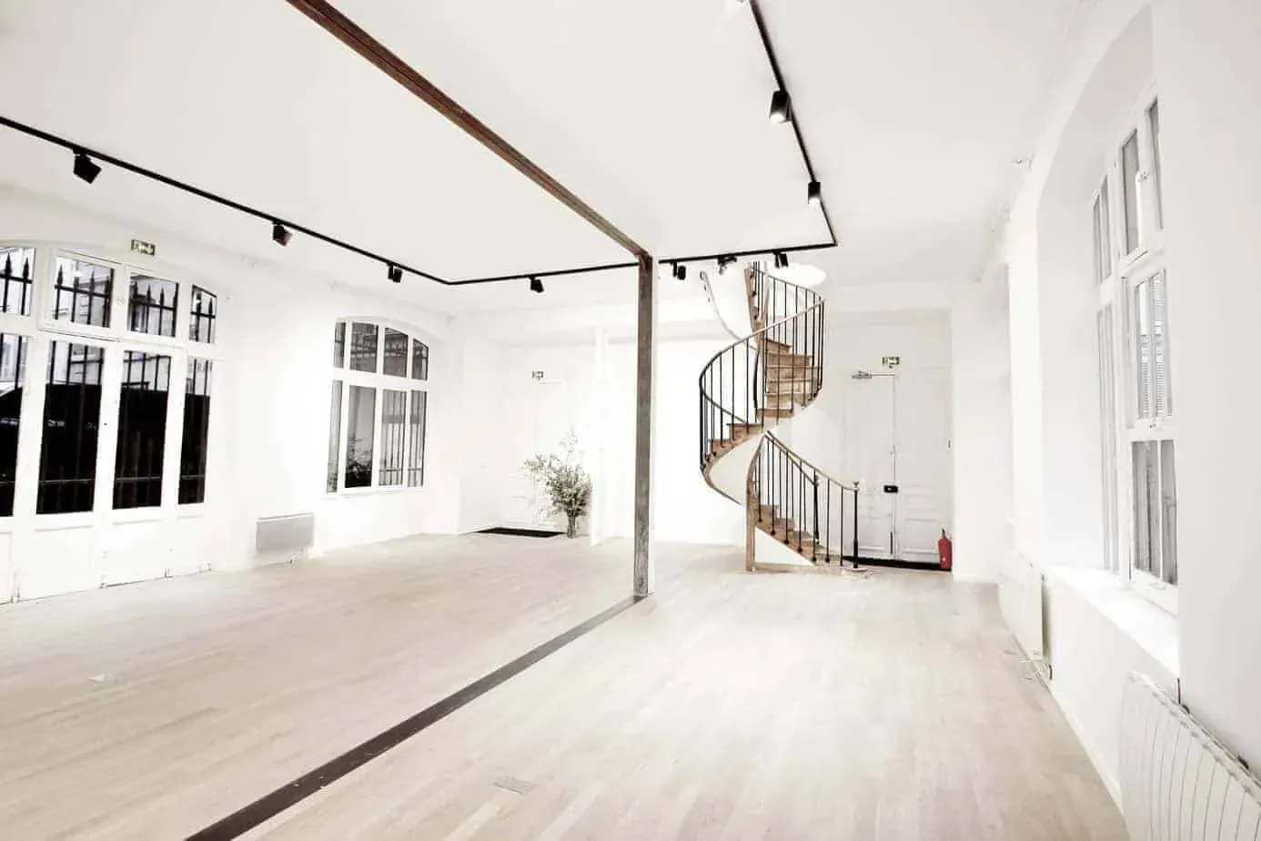 Gallery with a spiral staircase across two levels