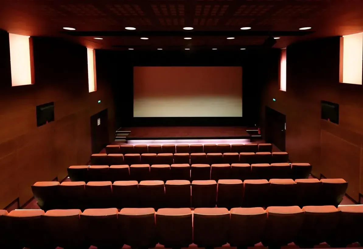 Auditorium view toward the screen from the back rows